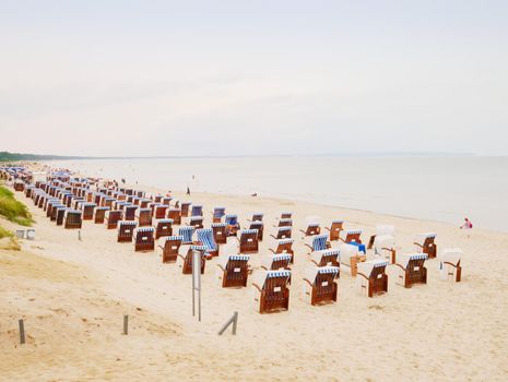 18th of August 2017, Binz, Germany. Sunny beach on Ruegen island, with typical canopied beach chairs 