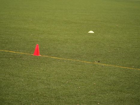 The plastic cones on turf football or soccer green field, Training equipment. Soccer Football Training Session, Training Football