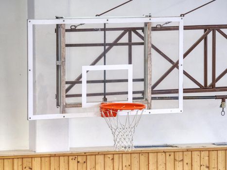 Basketball basket on construction. School gym with basketball board and basket