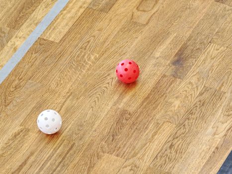 Floor-ball court. Painted wooden floor of sports hall with colorful marking lines. Schooll gym hall