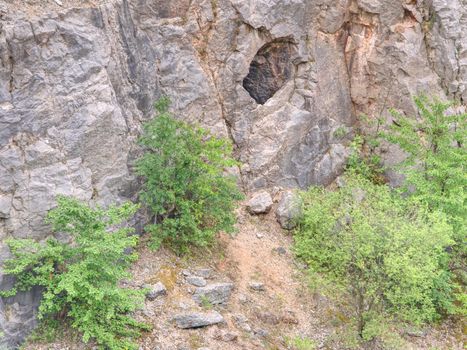 Adit in old abandoned limestone quarry Velka Amerika.  Medieval tunnel adit exposed by modern mining in the 1950s.