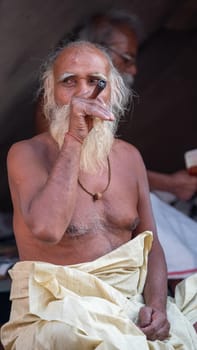 Haridwar, Uttarakhand, India April 12, 2021. Indian Saints in their traditional way of Yog Mudra, meditating. Sitting in silence as part of the initiation of new sadhus during Kumbha Mela. The Naga Sadhus.