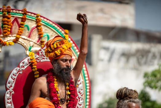 Haridwar, Uttarakhand. India- March 5, 2021- Indian sadhus coming to Kumbh Mela, Royal welcome. Sadhus sitting in rides, wearing a garland,