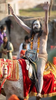 Haridwar, Uttarakhand. India- March 5, 2021- Indian sadhus coming to Kumbh Mela, Royal welcome. Sadhus sitting in rides, wearing a garland,