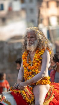 Haridwar, Uttarakhand. India- March 5, 2021- Indian sadhus coming to Kumbh Mela, Royal welcome. Sadhus sitting in rides, wearing a garland,