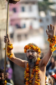 Haridwar, Uttarakhand. India- March 5, 2021- Indian sadhus coming to Kumbh Mela, Royal welcome. Sadhus sitting in rides, wearing a garland,