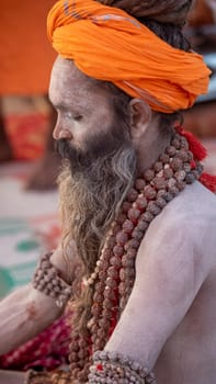 Haridwar, Uttarakhand, India April 12, 2021. Indian Saints in their traditional way of Yog Mudra, meditating. Sitting in silence as part of the initiation of new sadhus during Kumbha Mela. The Naga Sadhus.