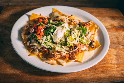 A plate of creamy nachos snack