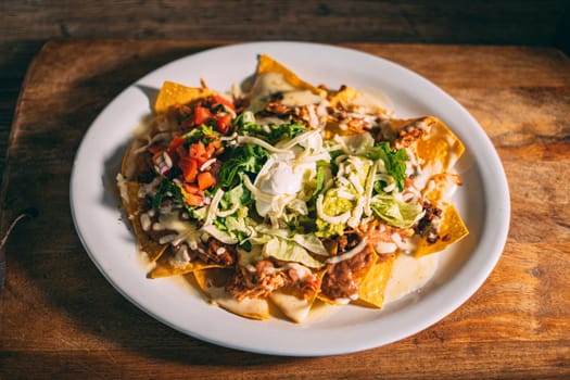 A plate of creamy nachos snack