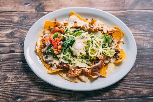 A plate of creamy nachos snack