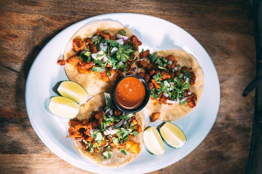 A plate of tacos and tortilla snacks