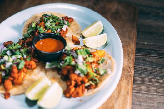 A plate of tacos and tortilla snacks