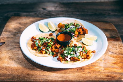 A plate of tacos and tortilla snacks