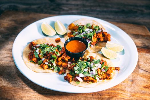 A plate of tacos and tortilla snacks