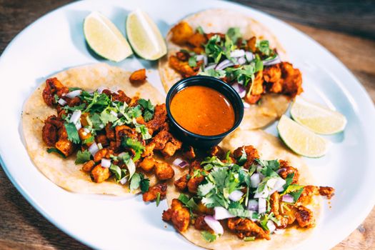 A plate of tacos and tortilla snacks