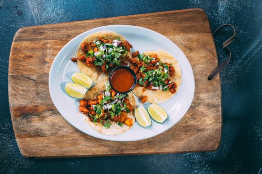 A plate of tacos and tortilla snacks