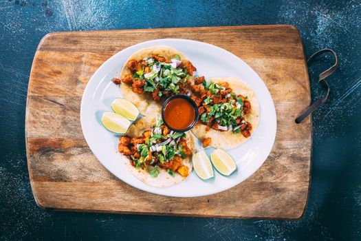 A plate of tacos and tortilla snacks