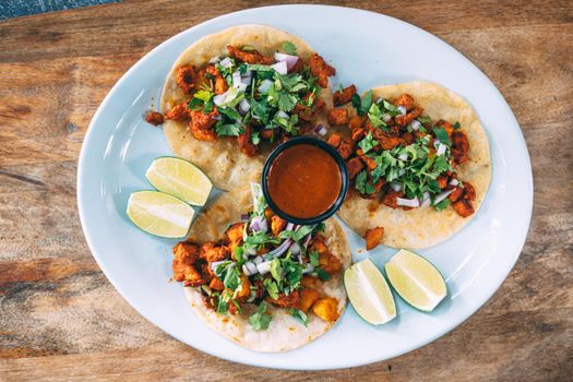 A plate of tacos and tortilla snacks