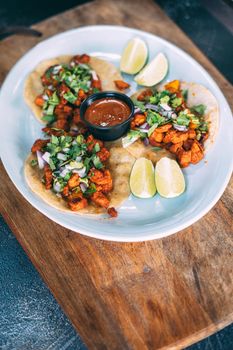 A plate of tacos and tortilla snacks