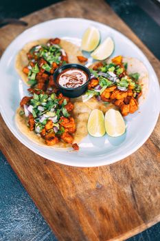 A plate of tacos and tortilla snacks