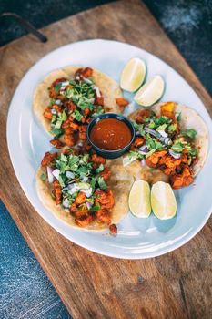 A plate of tacos and tortilla snacks