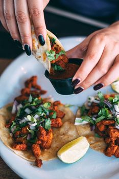 A plate of tacos and tortilla snacks