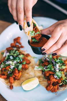 A plate of tacos and tortilla snacks