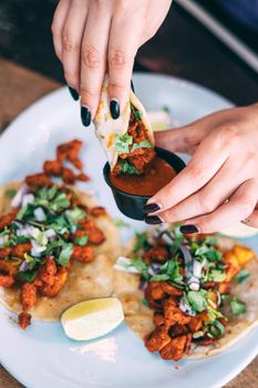 A plate of tacos and tortilla snacks