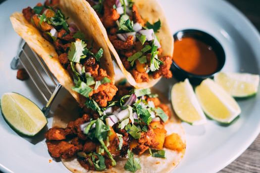 A plate of tacos and tortilla snacks