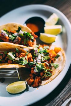 A plate of tacos and tortilla snacks