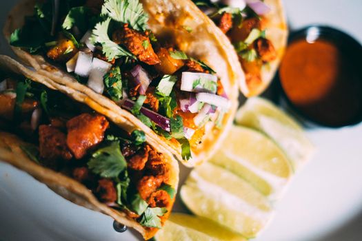 A plate of tacos and tortilla snacks