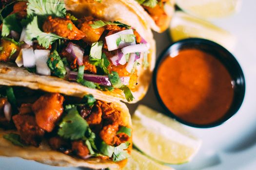 A plate of tacos and tortilla snacks