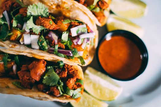 A plate of tacos and tortilla snacks