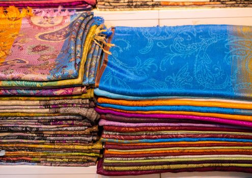 Pile of bright Multi-colored pieces of fabric in a bazaar