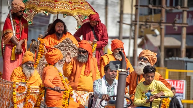 Haridwar, Uttarakhand. India- March 5, 2021- Indian sadhus coming to Kumbh Mela, Royal welcome. Sadhus sitting in rides, wearing a garland,