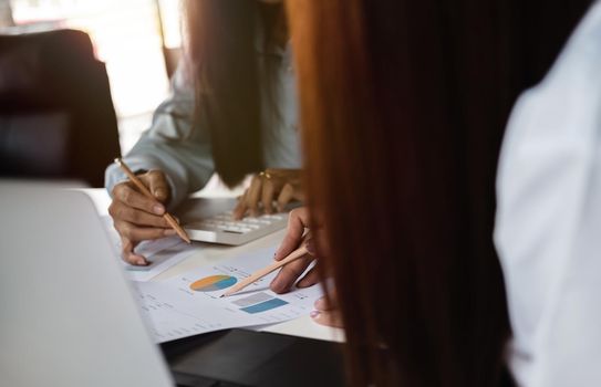 Close up business people discuss to working with using tablet and for searching information stock market chart for trading to Make a profit. Planning and Investment concept.