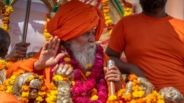 Haridwar, Uttarakhand. India- March 5, 2021- Indian sadhus coming to Kumbh Mela, Royal welcome. Sadhus sitting in rides, wearing a garland,