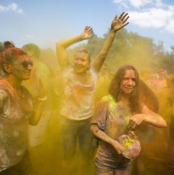 Holi colors holiday. Crazy crowd of young people having fun during festival of colors ColorFest in Kyiv, Ukraine