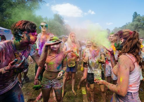 Holi colors holiday. Crazy crowd of young people having fun during festival of colors ColorFest in Kyiv, Ukraine