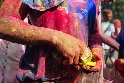 Holi colors holiday. Crazy crowd of young people having fun during festival of colors ColorFest in Kyiv, Ukraine