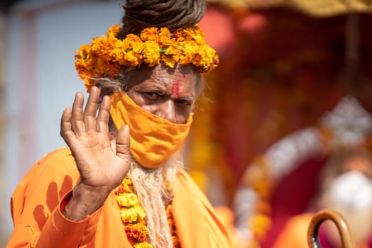 Haridwar, Uttarakhand. India- March 5, 2021- Indian sadhus coming to Kumbh Mela, Royal welcome. Sadhus sitting in rides, wearing a garland,