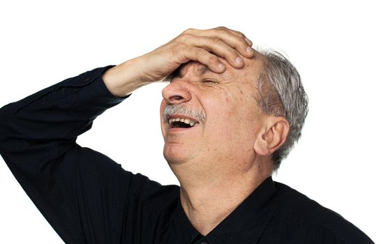 Health and illness concept. Elderly man suffers from headache and holds his head by hand isolated on white with copy space