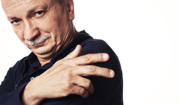 Portrait of a successful elderly man isolated on white background with copy-space.  High-contrast image with intentional color shift