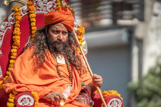 Haridwar, Uttarakhand. India- March 5, 2021- Indian sadhus coming to Kumbh Mela, Royal welcome. Sadhus sitting in rides, wearing a garland,