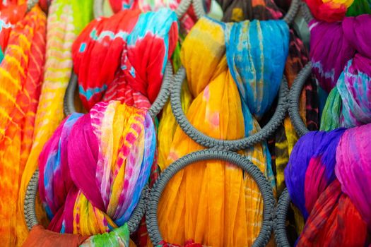 Pile of bright Multi-colored pieces of fabric in a bazaar