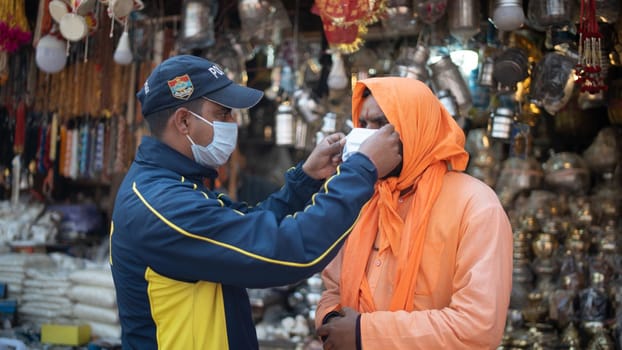 Haridwar, Uttarakhand India April 06, 2021. Policemen spreading awareness of protection from Coronavirus to stay safe from Coronavirus during Maha Kumbh 2021. Apple prores 422 High-quality 4k footage.