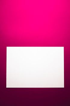 Blank A4 paper, white on pink background as office stationery flatlay, luxury branding flat lay and brand identity design for mockup.