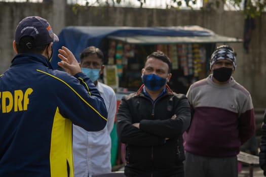 Haridwar, Uttarakhand India April 06, 2021. Policemen spreading awareness of protection from Coronavirus to stay safe from Coronavirus during Maha Kumbh 2021. Apple prores 422 High-quality 4k footage.