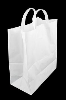 used white paper bag with handles isolated on black background.