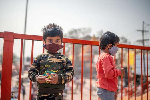 Haridwar, Uttarakhand India April 06, 2021. Indian children wearing protection mask to stay safe from Coronavirus during Maha Kumbh 2021 High-quality